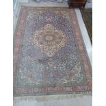 A Persian rug with a central serpentine outlined diamond motif,