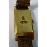 An early 1930s 18ct gold rectangular cased digital wristwatch, the back stamped SD503361,