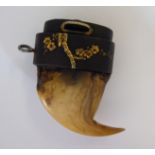 A Japanese two-part shakudo and eagle's beak netsuke design pendant,