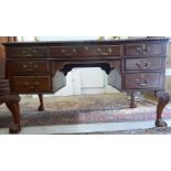 An early 20thC mahogany kneehole desk,