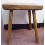 A mid/late 19thC country made oak and elm work stool, the rectangular block top raised on straight,