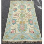 A Persian rug with three central motifs,