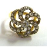 An 18ct gold and diamond set ring of free flowing form