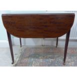 An early 19thC mahogany Pembroke table, having crossbanded,