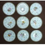 A set of nine early 20thC Continental ivory glazed porcelain dessert plates with thumb moulded,