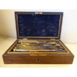 A late Victorian lacquered brass set of engineers' drawing instruments,