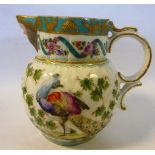 A late 18thC style Continental moulded porcelain jug of bulbous form with a double C-scrolled