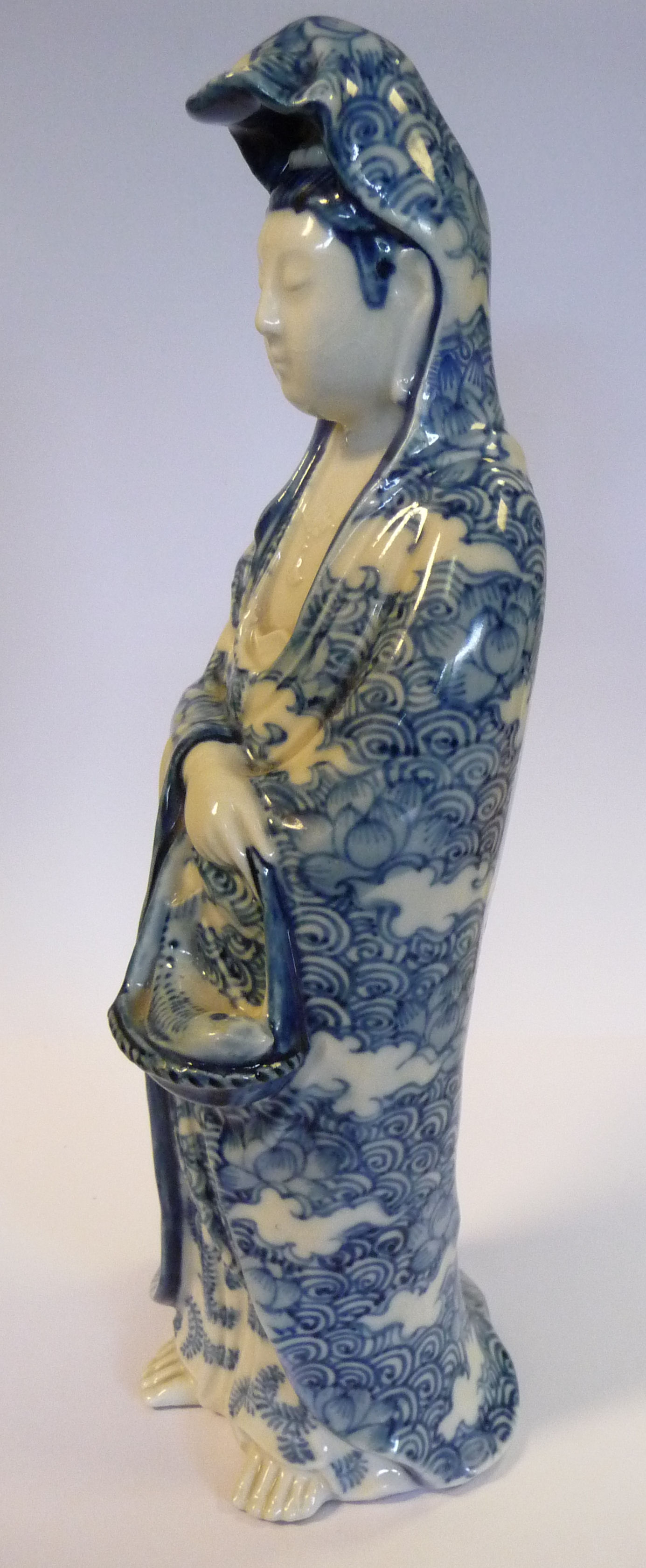 An early 20thC Chinese porcelain standing figure, Guan Yin, holding a basket of fish, - Image 3 of 11