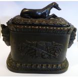 A mid 19thC dark stained and moulded earthenware tobacco box of straight sided, oval form,