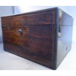 An early Victorian rosewood veneered vanity box with brass corners, string inlaid ornament,