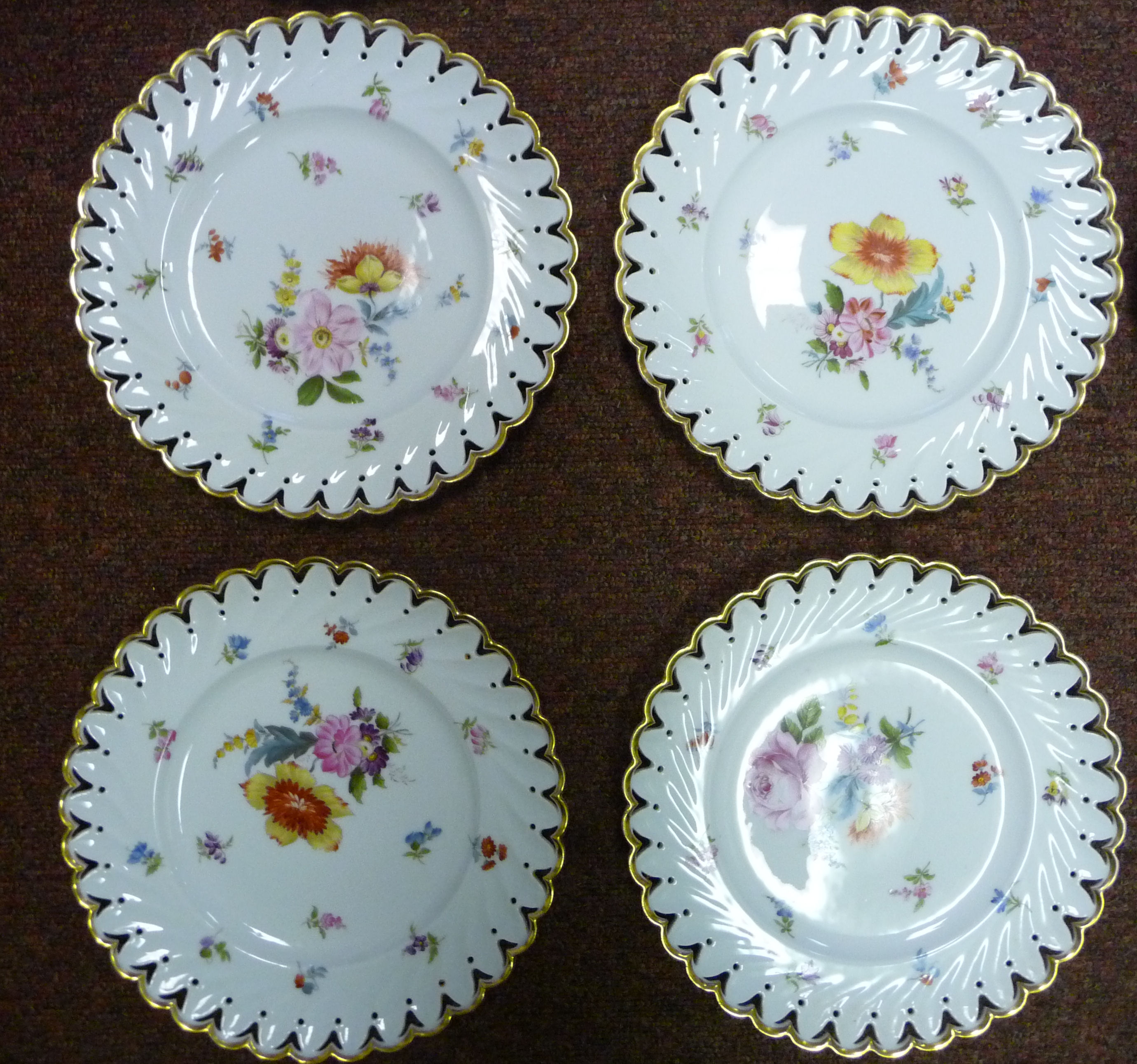 A set of nine early 20thC Continental ivory glazed porcelain dessert plates with thumb moulded, - Image 4 of 11
