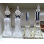A pair of Edwardian slice-cut glass perfume bottles of tapered,