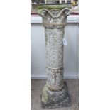 A modern decoratively cast composition stone pedestal,