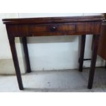 A George III mahogany tea table, the foldover top raised on a rear gateleg action and square,