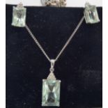 A 9ct white gold, green quartz and diamond set pendant,