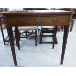 A late 19thC oak and other hall table, the top with canted corners, over a frieze drawer,