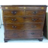 An early 19thC mahogany and marquetry dressing chest,