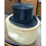 A black silk top hat size 6/7.