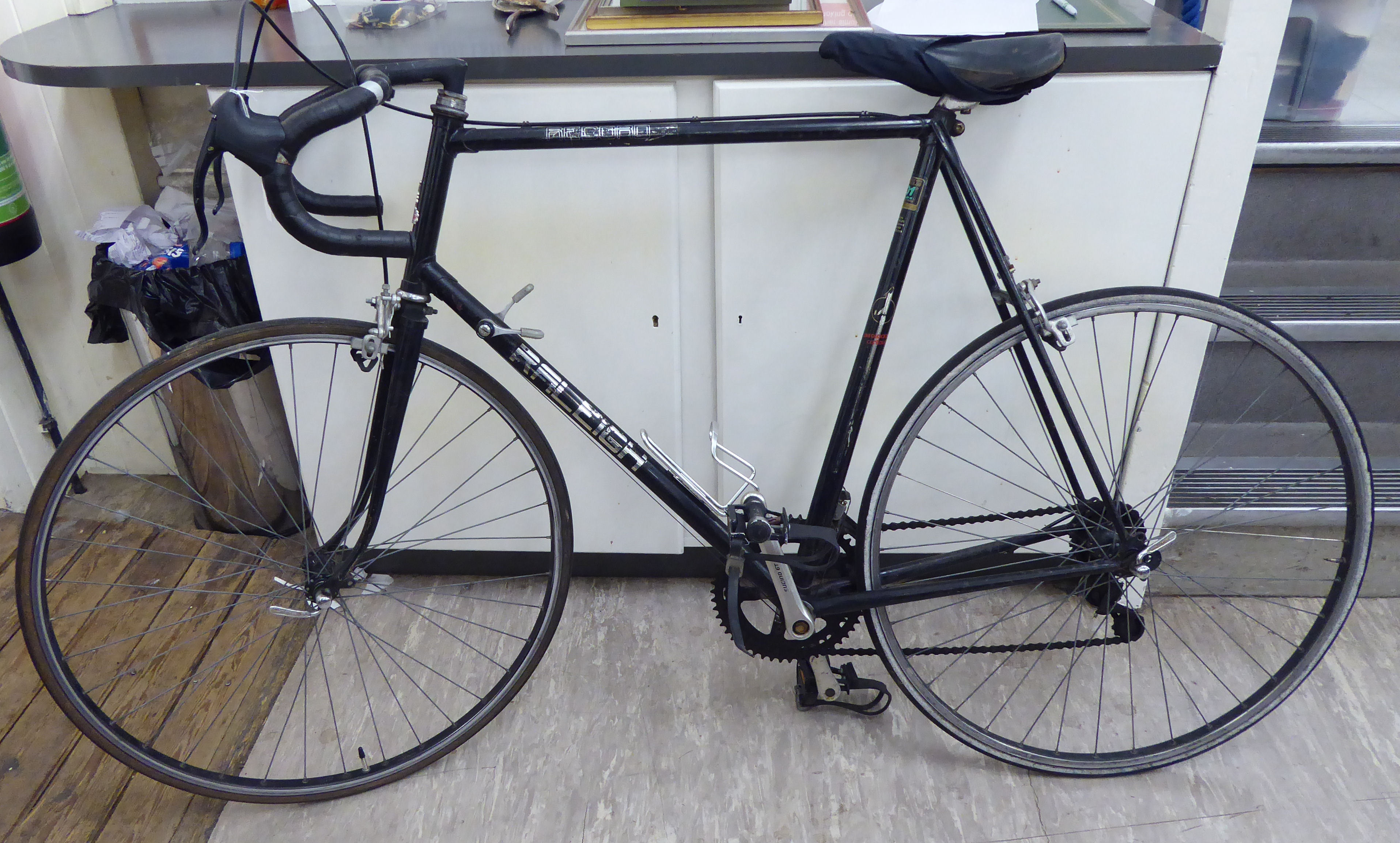 A gentleman's Raleigh Record racing bicycle, in black with drop handlebars,