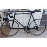 A gentleman's Raleigh Record racing bicycle, in black with drop handlebars,