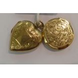 Two dissimilar gold coloured metal lockets, one heart shaped, the other,