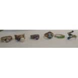 Six variously gem set silver dress rings 11