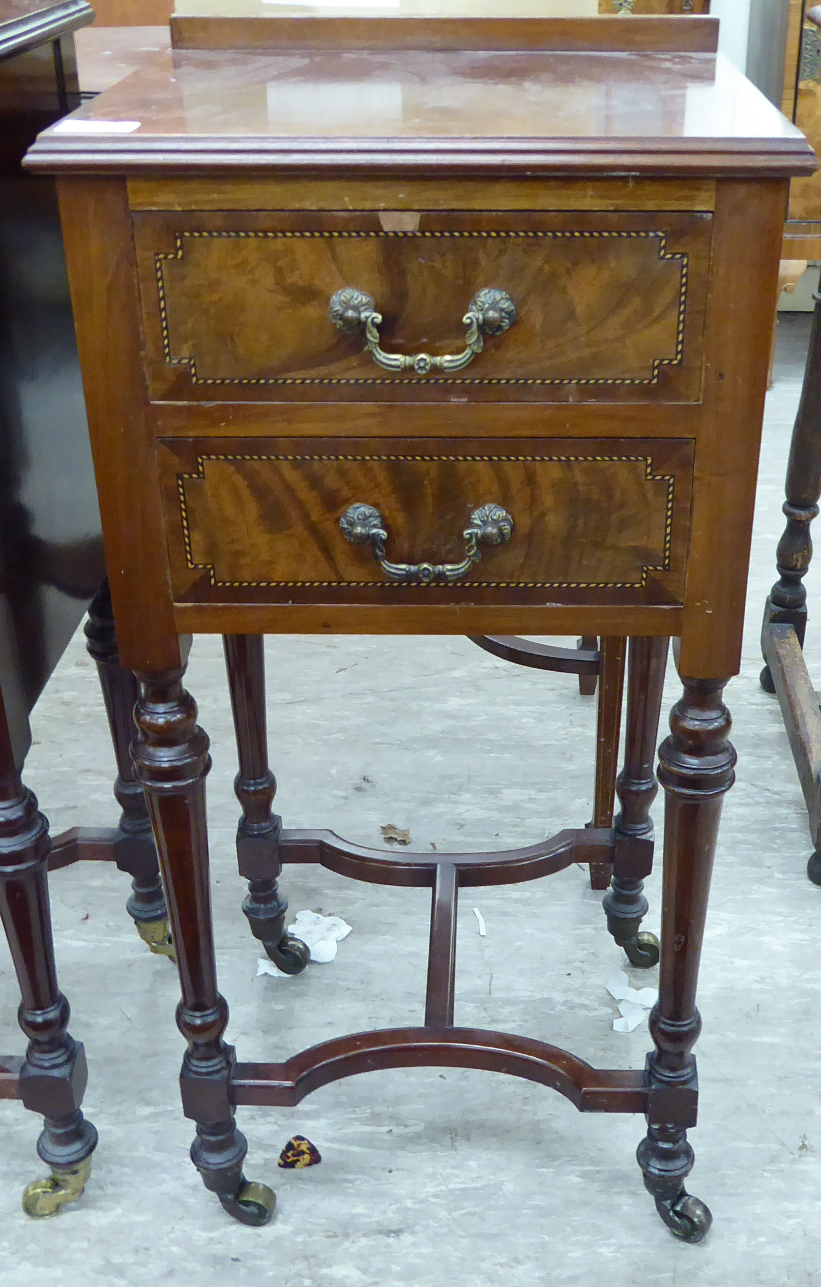 An Edwardian satinwood and ebony inlaid mahogany bedside chest, comprising two drawers,