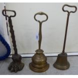 Three late 19thC brass door porters with ring handles, viz.