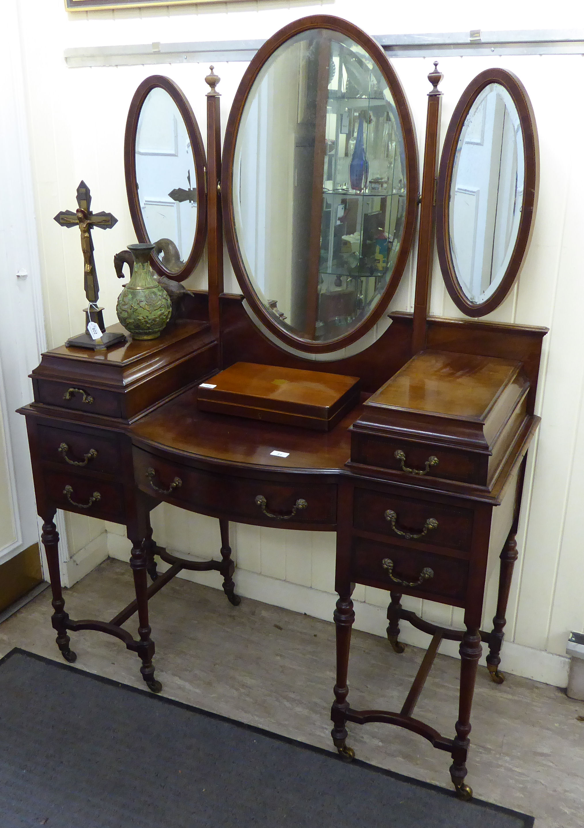 An Edwardian satinwood and ebony inlaid mahogany dressing table,