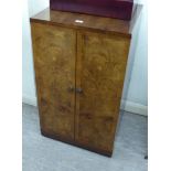 A mid 20thC Marconiphone walnut two door television cabinet,