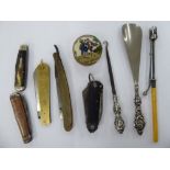 A mixed lot: to include a late 19thC bone handled cut-throat razor and a Rajput Cutlery brass