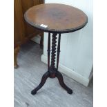 A late Victorian pedestal table with a circular top, having a crimped metal edge,