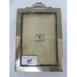 A Mappin & Webb silver photograph frame 5'' x 4'' on a fabric covered easel back London 1916