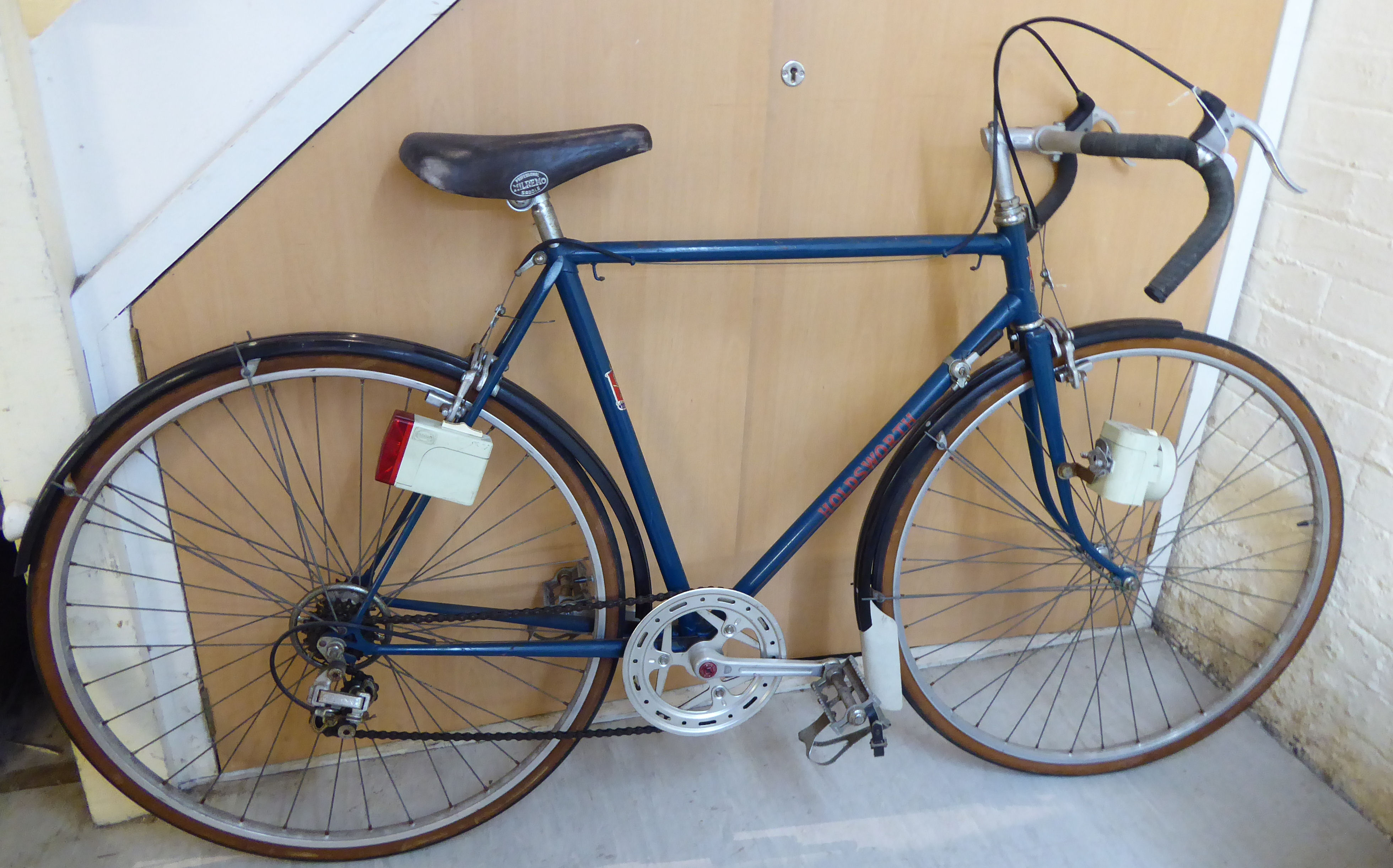 A gentleman's Holdsworth racing bike, in navy blue and black with drop handlebars,