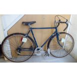 A gentleman's Holdsworth racing bike, in navy blue and black with drop handlebars,