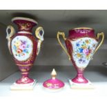 Two similar Limoges china twin handled vases, decorated with flora and gilding,