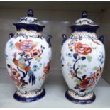 A pair of Wilton Losel Ware Burslem china, twin handled, ovoid shaped vases and covers,