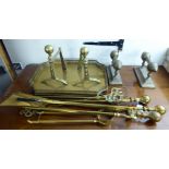 Early 20thC brassware: to include a set of three fire irons with spherical handgrips BSR