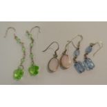 Three dissimilar pairs of silver pendant earrings 11