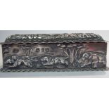 A late Victorian ring box of casket form, embossed with a boar hunting scene,