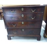 A mid 19thC mahogany dressing chest, the four graduated long drawers with cock beading,
