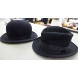 A Dunn & Co black bowler hat size 6/7.