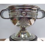 An Irish silver twin handled pedestal trophy cup, decorated with Celtic ornament Dublin 1942,