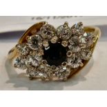 A 9ct gold sapphire and cubic zirconia set cluster ring 11