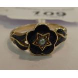 An 'antique' gold coloured metal and black enamel mourning ring,