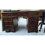 A modern mahogany nine drawer, twin pedestal desk,