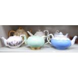 Six various late 19th & 20thC porcelain and china teapots: to include a Leedsware cream glazed