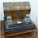 A late Victorian brass mounted oak desktop stationary box with a hinged lid,