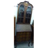 A mid 20thC Queen Anne style walnut bureau bookcase,