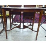 An Edwardian mahogany satinwood inlaid side table, the top having a bow front, raised on square,